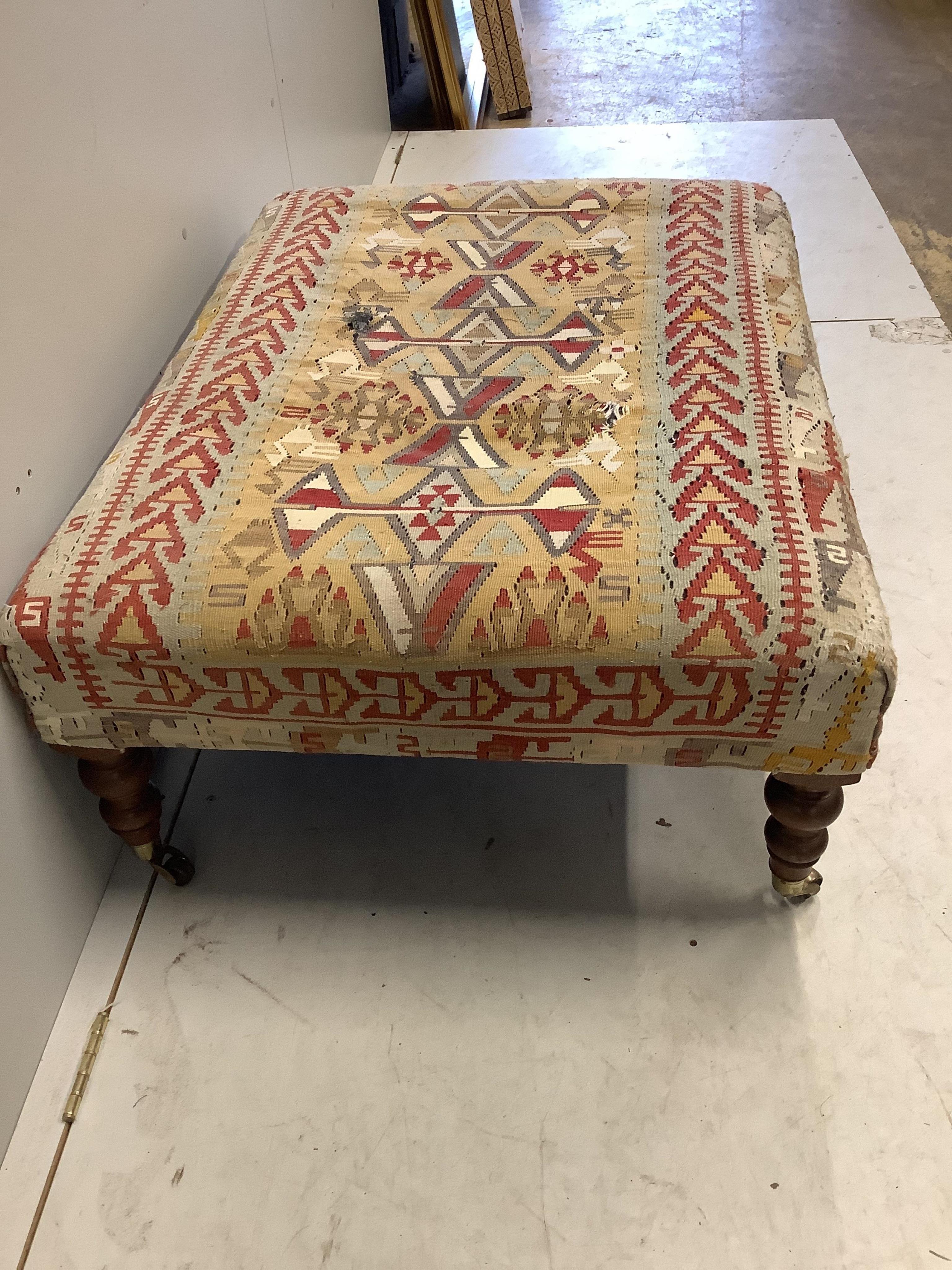 A rectangular Victorian style footstool with Kilim upholstery, width 102cm, depth 76cm, height 41cm. Condition - poor to fair